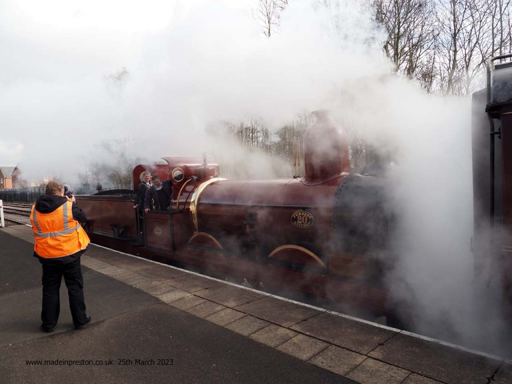 The Mayor of Preston, Neil Derby and colleague, depart the station on Furness Trust loco 20. The oldest working loco in Britain. At the Ribble Steam Railway on 25th March 2023.